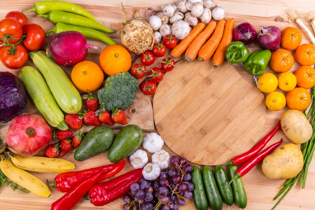 Fresh raw fruits and vegetables that support healthy skin through diet