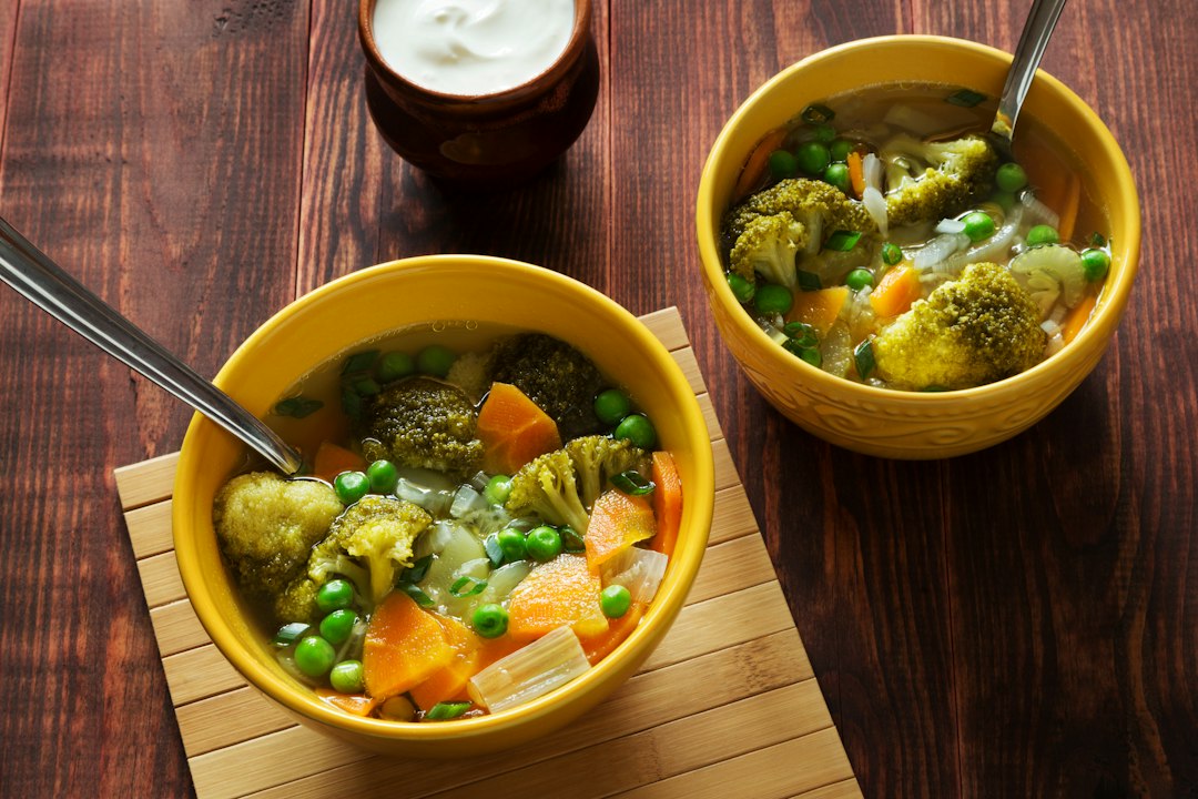 Bowls of warm vegetable soup, an easy winter meal for older adults